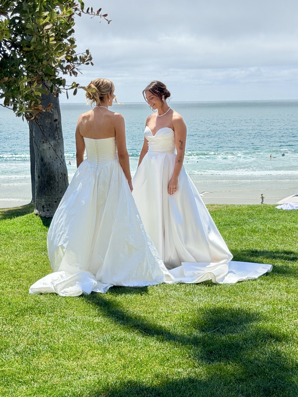Two brides by the ocean