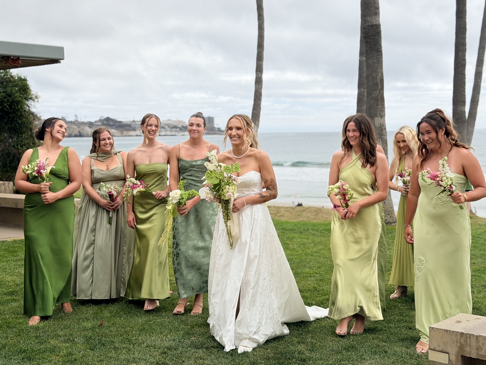 Bride with bridesmaids in sage and green