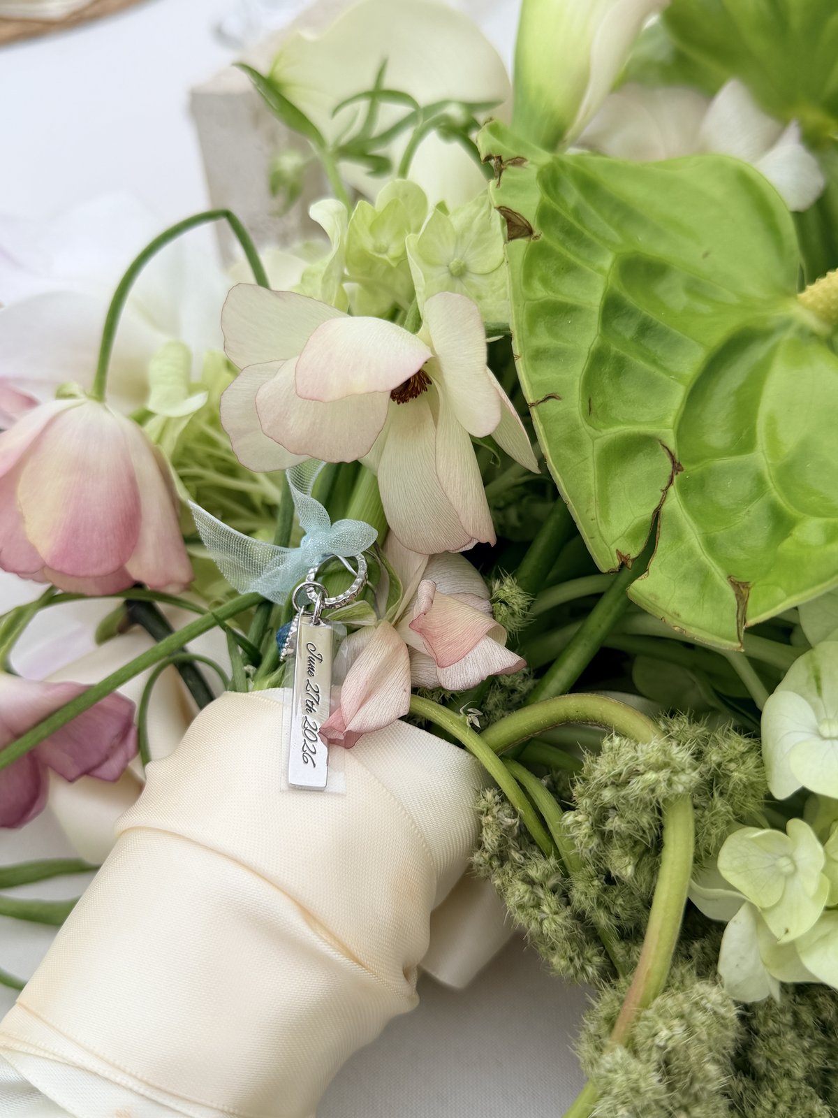 Engraved bouquet charm detail