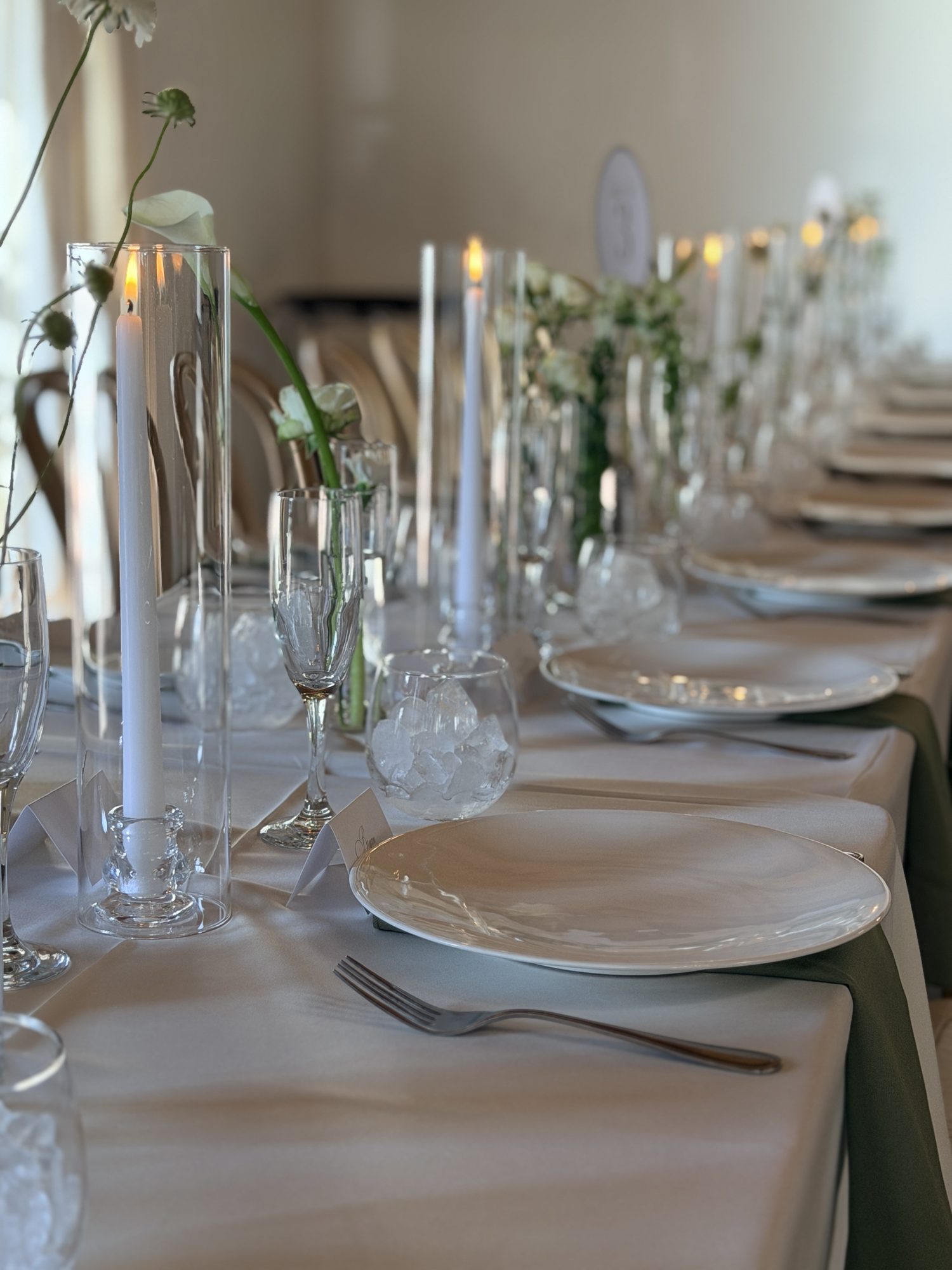 Table setting with lit candles and florals
