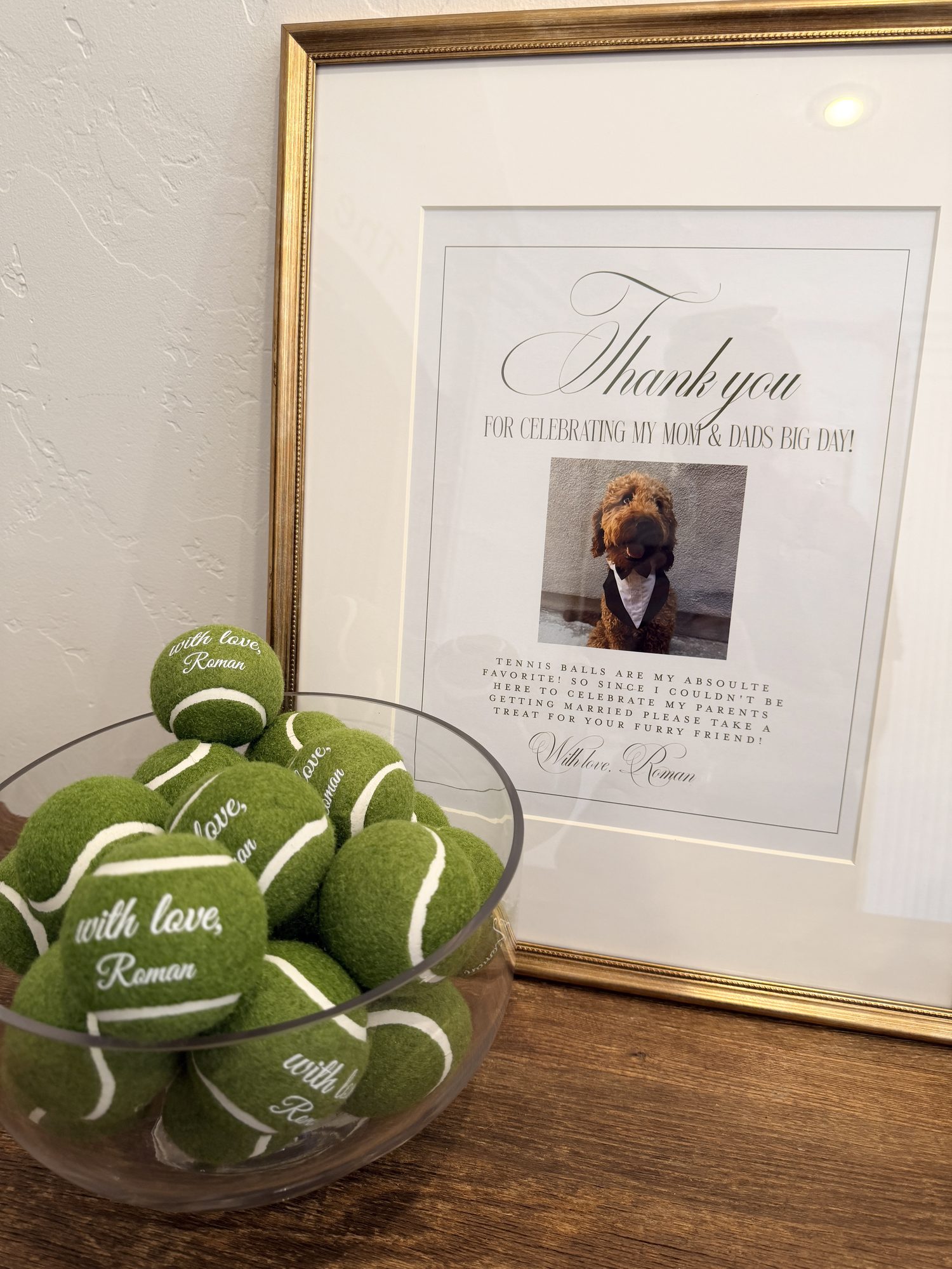 Thank you sign with family dog photo and tennis ball favors