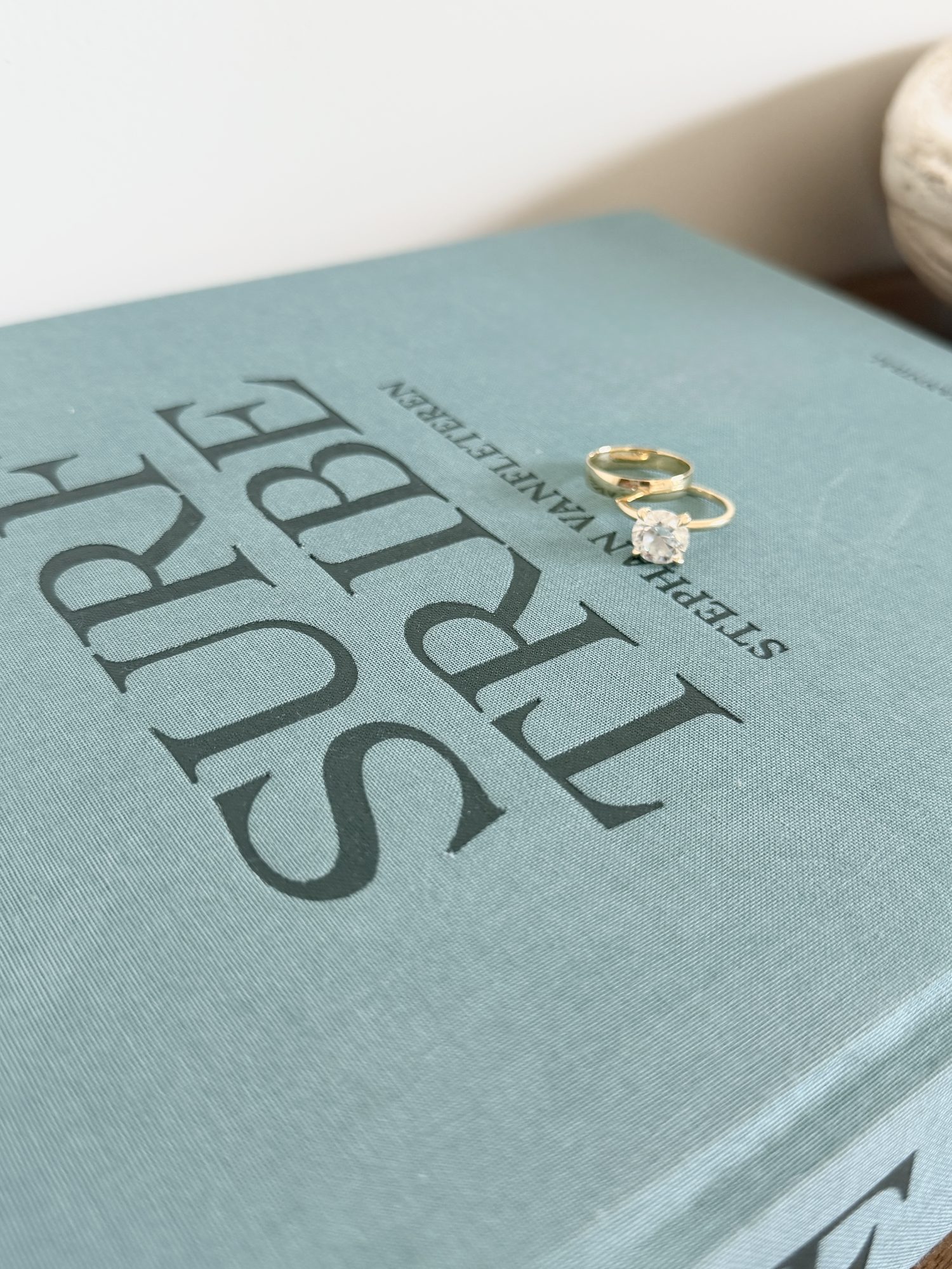 Wedding rings resting on a book