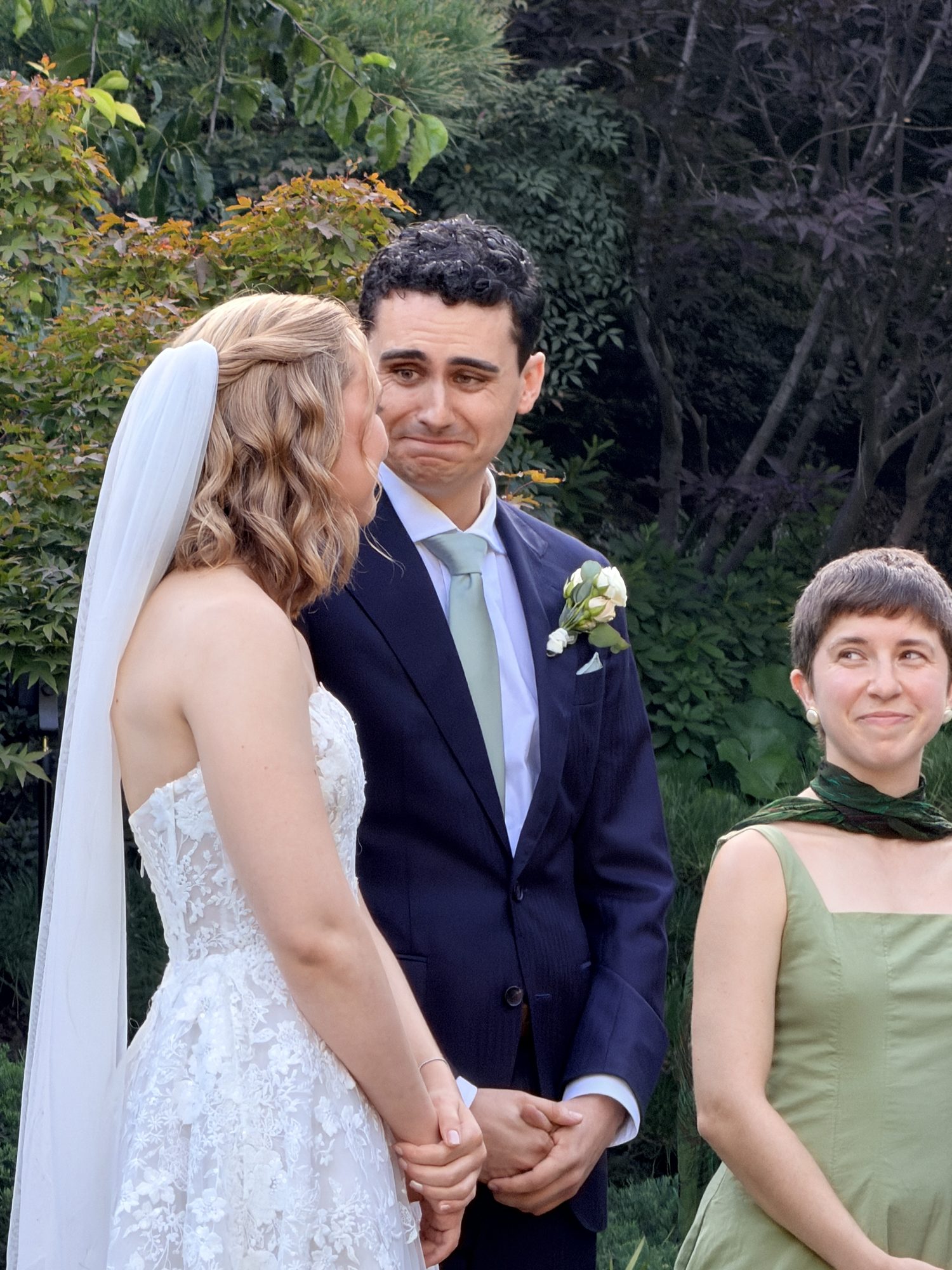 Emotional moment between bride and groom during ceremony