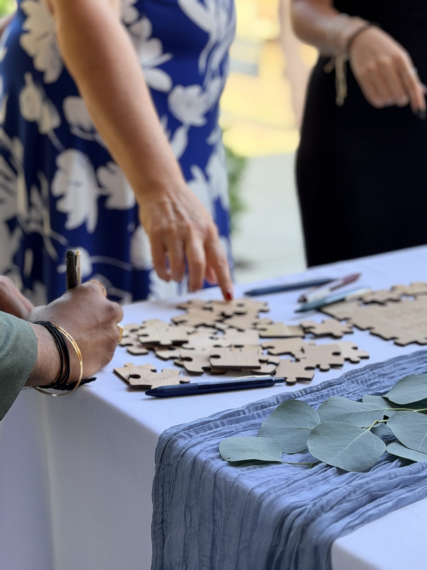 Guests signing puzzle piece guest book